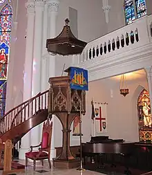 Gothic-revival "wine glass" pulpit and sounding board from 1872 in St. Matthew's German Evangelical Lutheran Church, Charleston, South Carolina