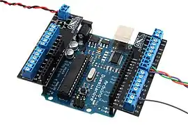 Screw-terminal breakout shield in a wing-type format, allowing bare-end wires to be connected to the board without requiring any specialized pins