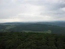 View from the viewing tower of the Pferdskopf of the Wolsküppel (centre) and Dorf Riedelbach (left)