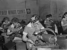 Women in industry. Tool production. A job which was formerly done by hand (and by men) is done in this large Midwest drill and tool plant by women at machines. These young workers are putting precision-ground points on drills which will be used in production of America's ships, tanks and guns. It takes at least four months to train these young women in the operation of these machines, but at the end of that period their work is speedy and efficient, and this company has found that both production and the quality of the drill points have improved. Republic Drill and Tool Company, Chicago, Illinois.