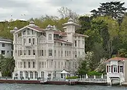 Two- and three-story colored houses with docks and balconies, built directly on the edge of the water