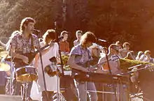 Performing in Dunedin, 1986. L-R: Rob Hellriegel, Jan Hellriegel, Mark Petersen, David Wood (Kevin Fielden obscured)