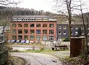 Former concentration camp as it looks today; monument is in foreground (at right)