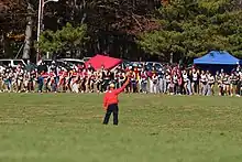 Image 33The start of a typical cross country race, as an official fires a gun to signal the start (from Cross country running)