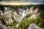 Large waterfall in a rocky mountain landscape.