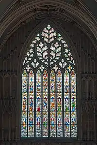 The west window (1338–39), with curvilinear tracery in the Decorated style