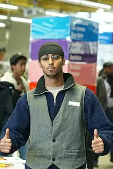 Image 51Somali man wearing waistcoat, tuque and polar fleece (from 2010s in fashion)