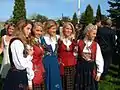 Young girls in different national costumes at Akershus