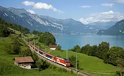 Image 26Zentralbahn Interregio train following the Lake Brienz shoreline, near Niederried in Switzerland (from Alps)