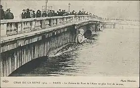 Zouave statue submerged above its waist by a flood at the old bridge in 1910