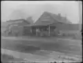 James Clyde's Blacksmith and Farrier Shop (right) and Farm Implement Sales Shop (left), [between 1895 and 1910]