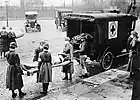 Red Cross workers remove a flu victim in St. Louis, Missouri (1918)