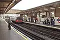 Acton Town station platforms, westbound Piccadilly line train arrives (September 2006)