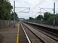 View northwards towards Conduit Lane, visible far in the distance beyond the station footbridge.