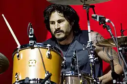 Wilk playing the drums in 2010