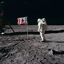 Buzz Aldrin with the US flag soon after stepping onto the surface.