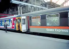 Two units, one in Network South East (N.S.E.) livery, while the other unit (an 'Essex Express') in what was nicknamed 'Jaffa Cake' livery