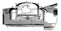 Coastal fortification with a rotating gun turret.