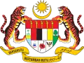 Shield showing symbols of the Malaysian states with a star and crescent above it and a motto below it supported by two tigers