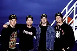 Creed in 2002 with former touring bassist Brett Hestla (far left)