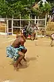 A traditional dance in Cameroon. The dancer is wearing a loincloth