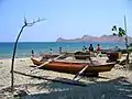 Canoes on shore at Dili