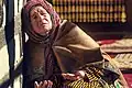 An old Balti Tibetan woman praying in a mosque in Khaplu, Pakistan