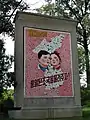 North Korean propaganda that states: "Let us pass on the united country to the next generation!".