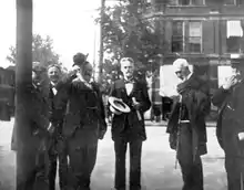 In this over-exposed photo, Cope is in the middle of the picture standing with other scientists.