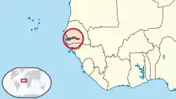 Location of the Gambia (dark red area within circle) on the coast of West Africa.