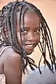 Ethiopian girl with her hair in braids.