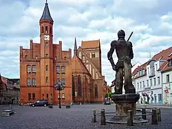 Market place of Perleberg with town hall, St James's church and Roland statue