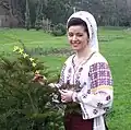 A Romanian woman in traditional dress.