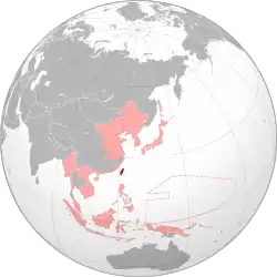 Taiwan (dark red) within the Empire of Japan (light red) at its furthest extent