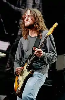 John Frusciante playing the guitar in 2014