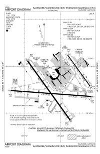 A map with a grid overlay showing the terminals runways and other structures of the airport.