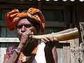 Man playing a karau dikur