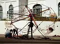 A simple powered carousel showing much of the mechanism that turns and lifts the seats