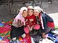 Uyghur girls in Khotan,Xinjiang, China. The scarves are longer than the European ones and cover both their heads and shoulders.