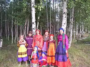 Scarved Komi girls in traditional costumes. They, like the Russians, Bashkirians and Moshka need to keep their heads warm in the winter weather.