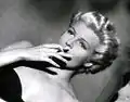 Rita Hayworth in film trailer; dyed blond.