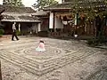 This old guest house in China has a mosaic with a Chinese symbol