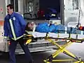 a paramedic uses a stretcher in 2001.