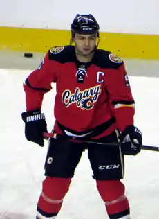 Giordano observes his teammates (off-camera) during a pre-game warm up