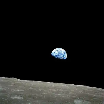  A picture of Earth taken from the Moon. The Earth is partly in shadow, so only half of it is visible