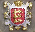 The arms of Oriel College, Oxford alludes to the institution's regal foundation by using the royal arms of England with a silver border added for difference.