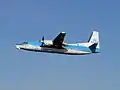 A KLM Cityhopper Fokker 50 taking off Amsterdam