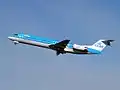 A KLM Cityhopper Fokker 100 taking off Amsterdam.