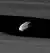 Two bright bands run from the left to right. In the narrow gap between them (Keeler gap), which has wavy edges, a small oblong object can be seen.