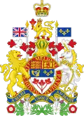 At the top there is a rendition of St. Edward's Crown, with the crest of a crowned gold lion standing on a twisted wreath of red and white silk and holding a maple leaf in its right paw underneath. The lion is standing on top of a helm, which is above the escutcheon, ribbon, motto and compartment. There is a supporter of either side of the escutcheon and ribbon; an English lion on the left and a Scottish unicorn on the right.